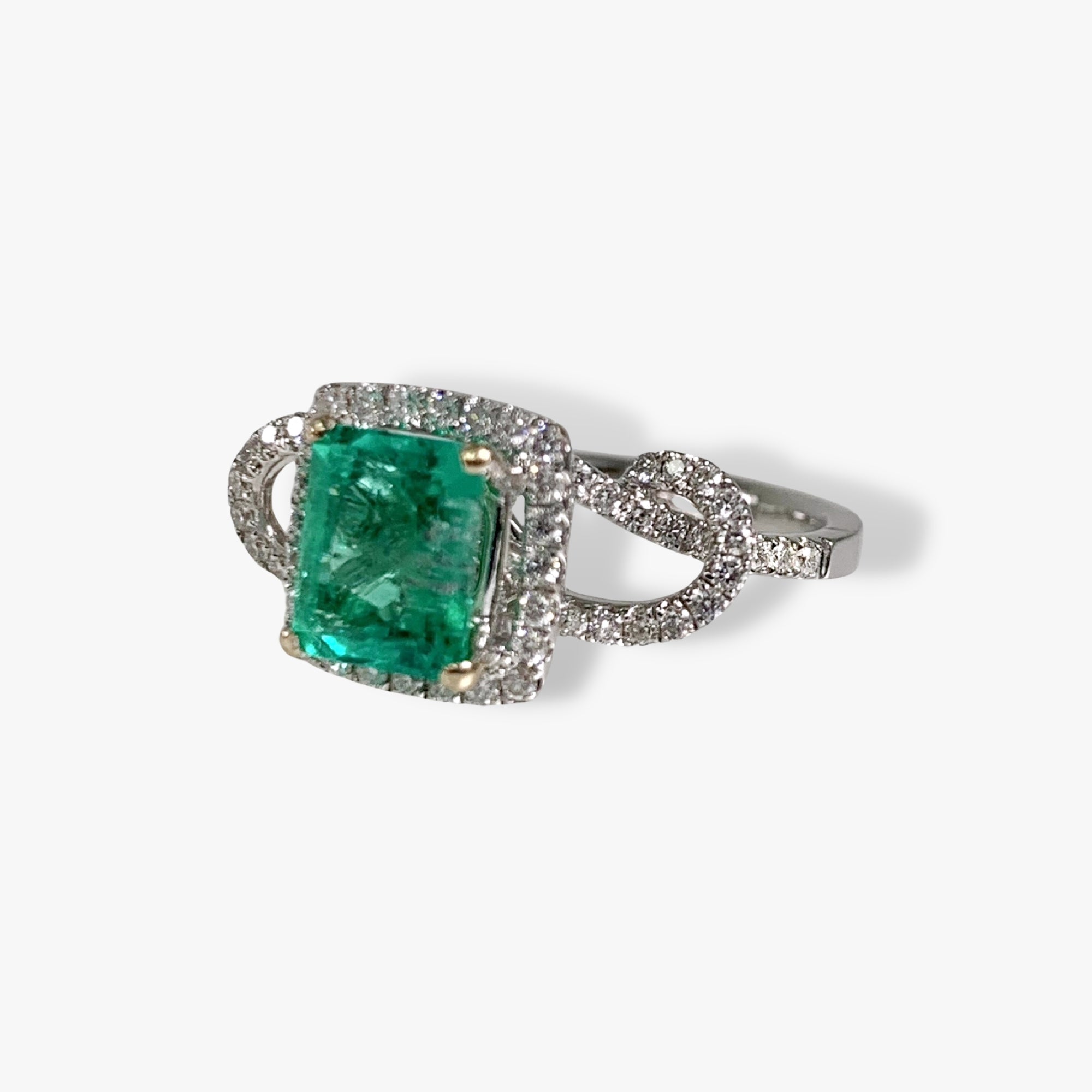 18k White Gold Emerald Cut Emerald and Diamond Halo Twisted Ring Side View