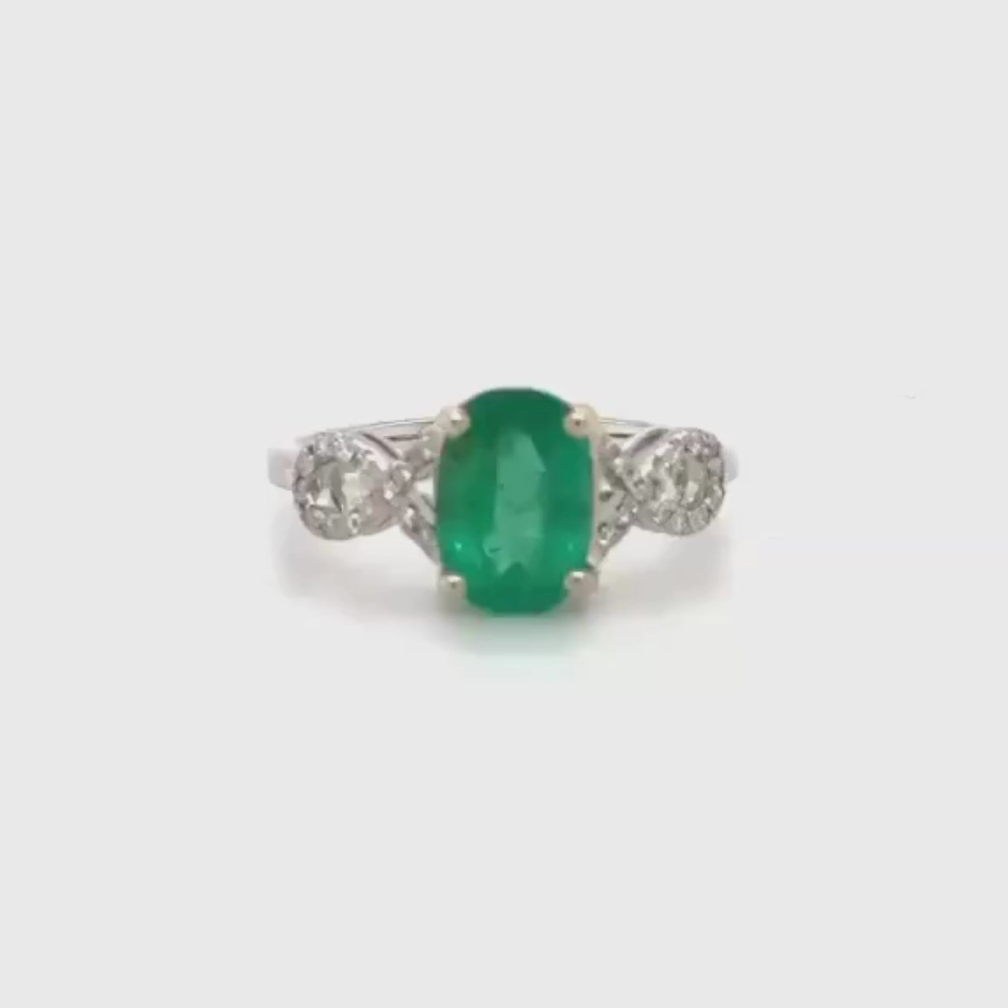14k White Gold Oval Cut Emerald and Diamond Twisted Shank Ring